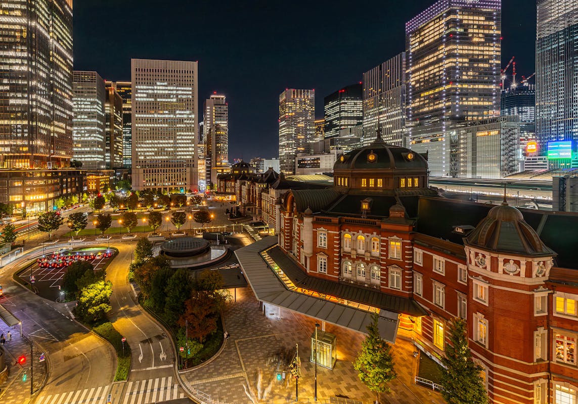 Tokyo Station Yaesu side at night with modern office towers and illuminated city lights